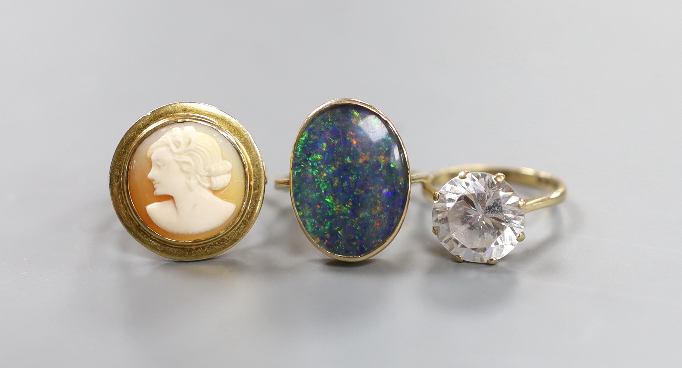 Three assorted modern 9ct dress rings, including cameo and simulated diamond, gross weight 16 grams.
